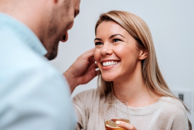 close-up-smiling-couple-drinking