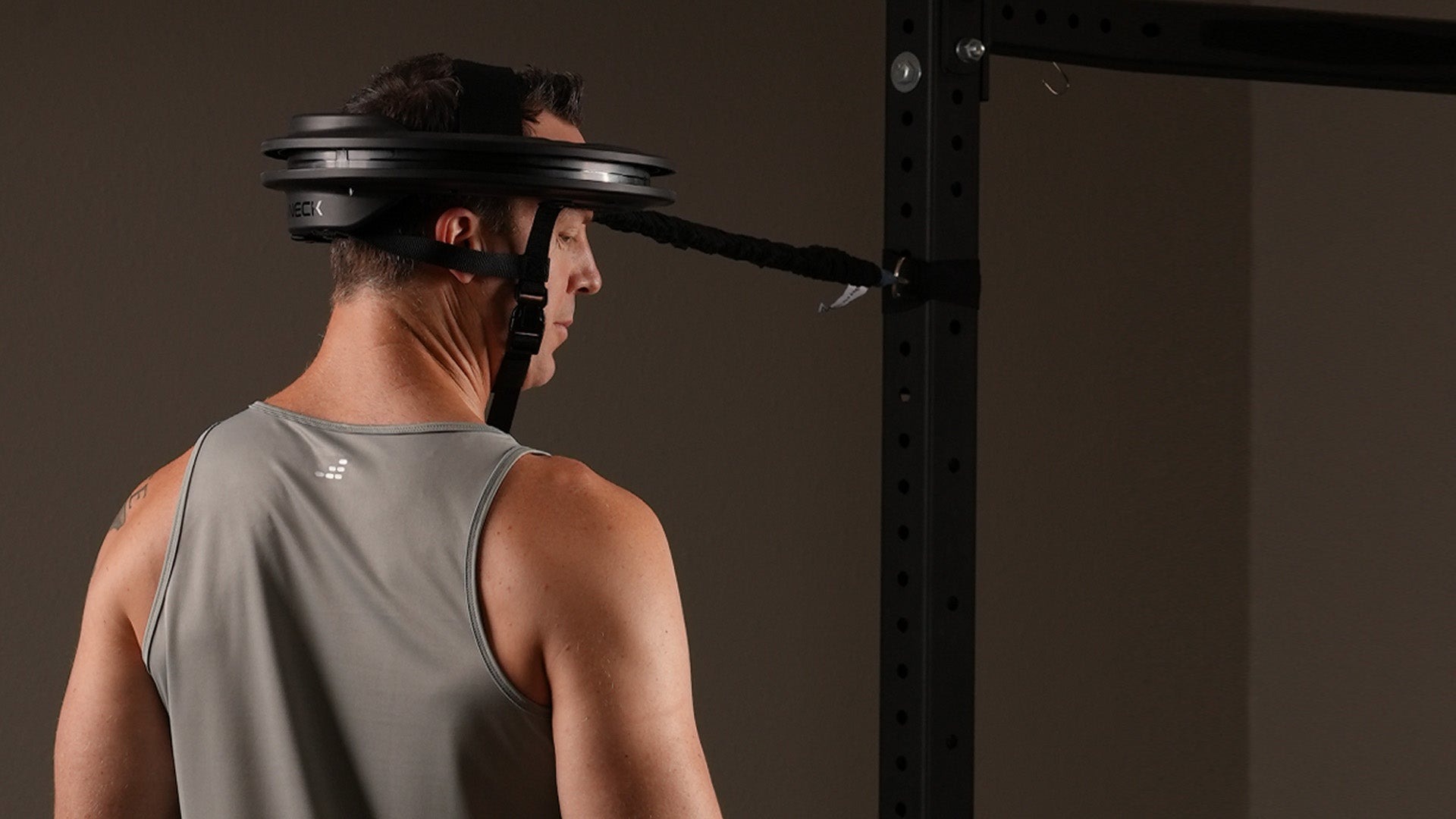 Male_athletes_using_the_Iron_Nec